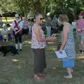 Pippa hands out some more dog biscuits, The Brome and Oakley Fete, Brome Hall, Suffolk - 12th July 2025