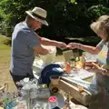 Tony sells something off his bric-a-brac stall, The Brome and Oakley Fete, Brome Hall, Suffolk - 12th July 2025