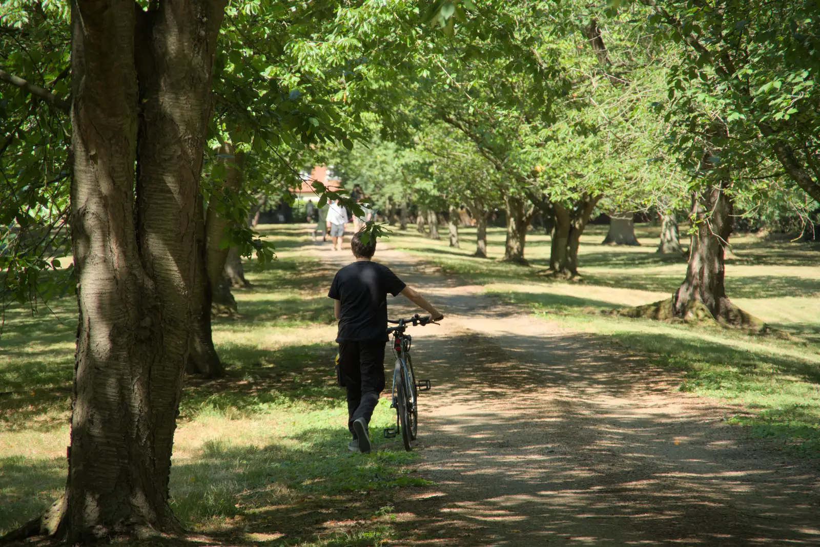 Fred heads off on his bike, from The Brome and Oakley Fete, Brome Hall, Suffolk - 12th July 2025