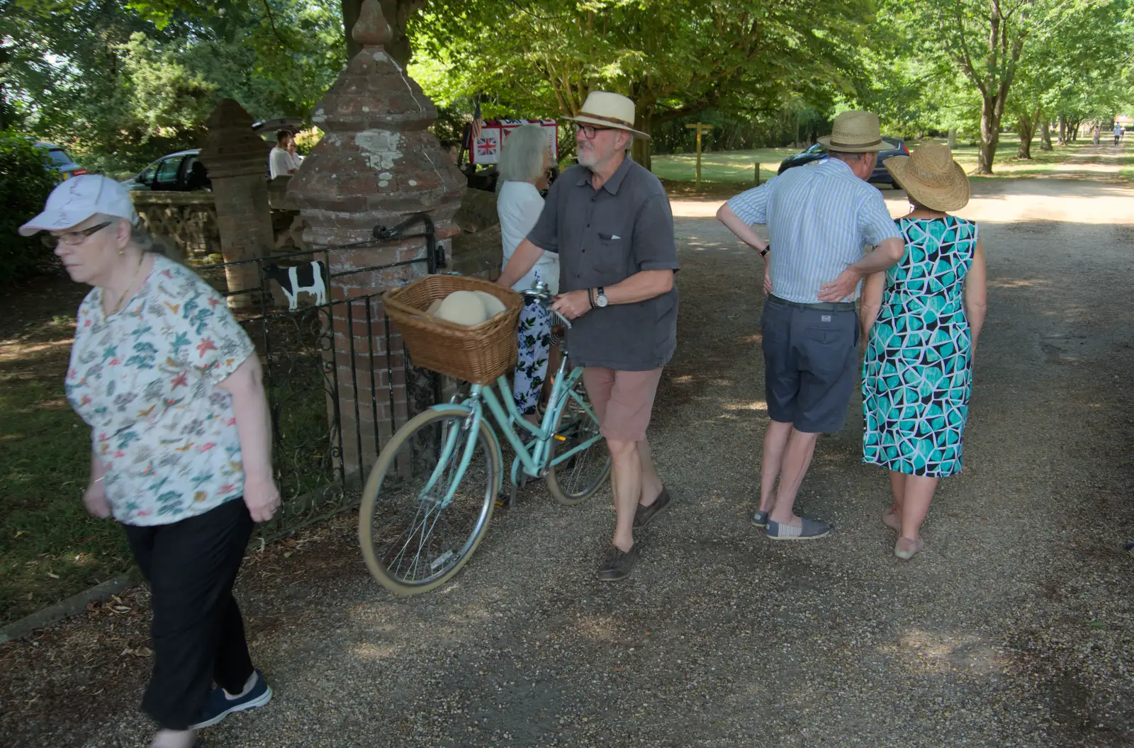 Tim wheels a bicycle around, from The Brome and Oakley Fete, Brome Hall, Suffolk - 12th July 2025