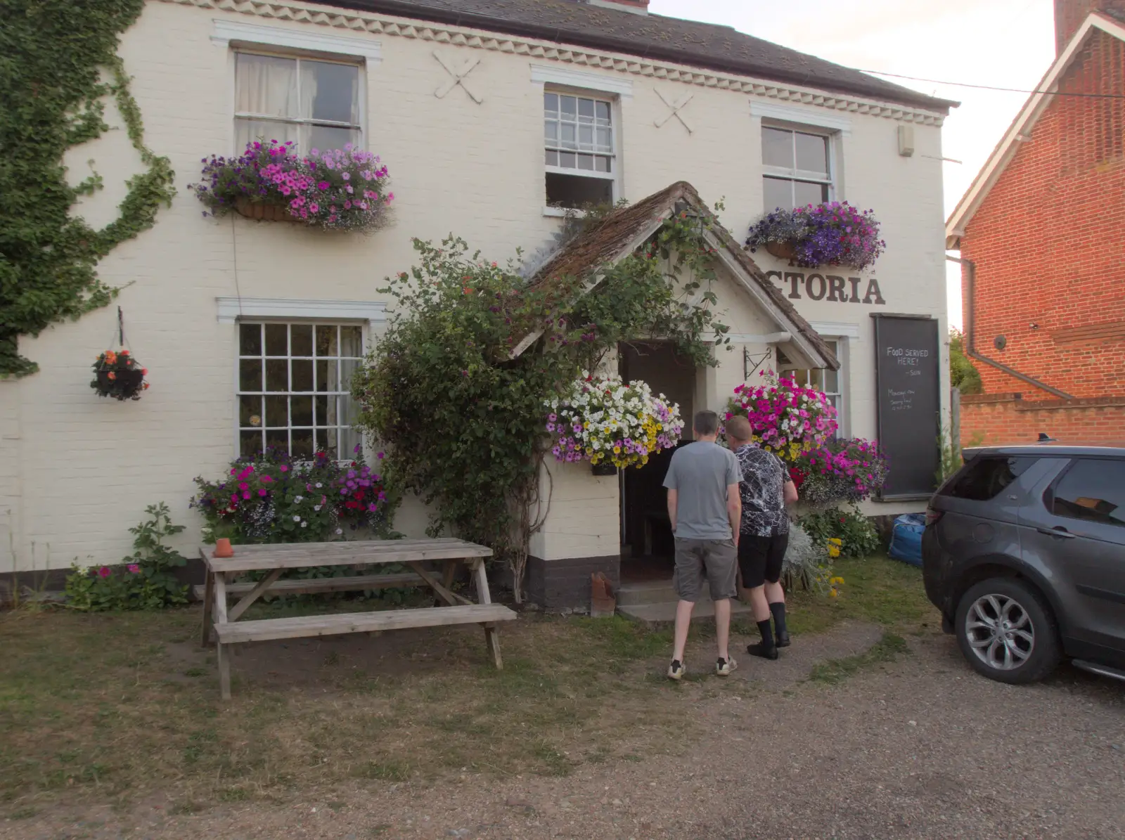 Phil and Gaz head into the Victoria at Earl Soham, from Anniversary Prosecco and BSSC Bike Rides, Suffolk - 17th July 2025