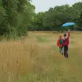 Harry holds an umbrella high in the air, A Wet Walk to the Black Horse, Thorndon, Suffolk - 20th July 2025