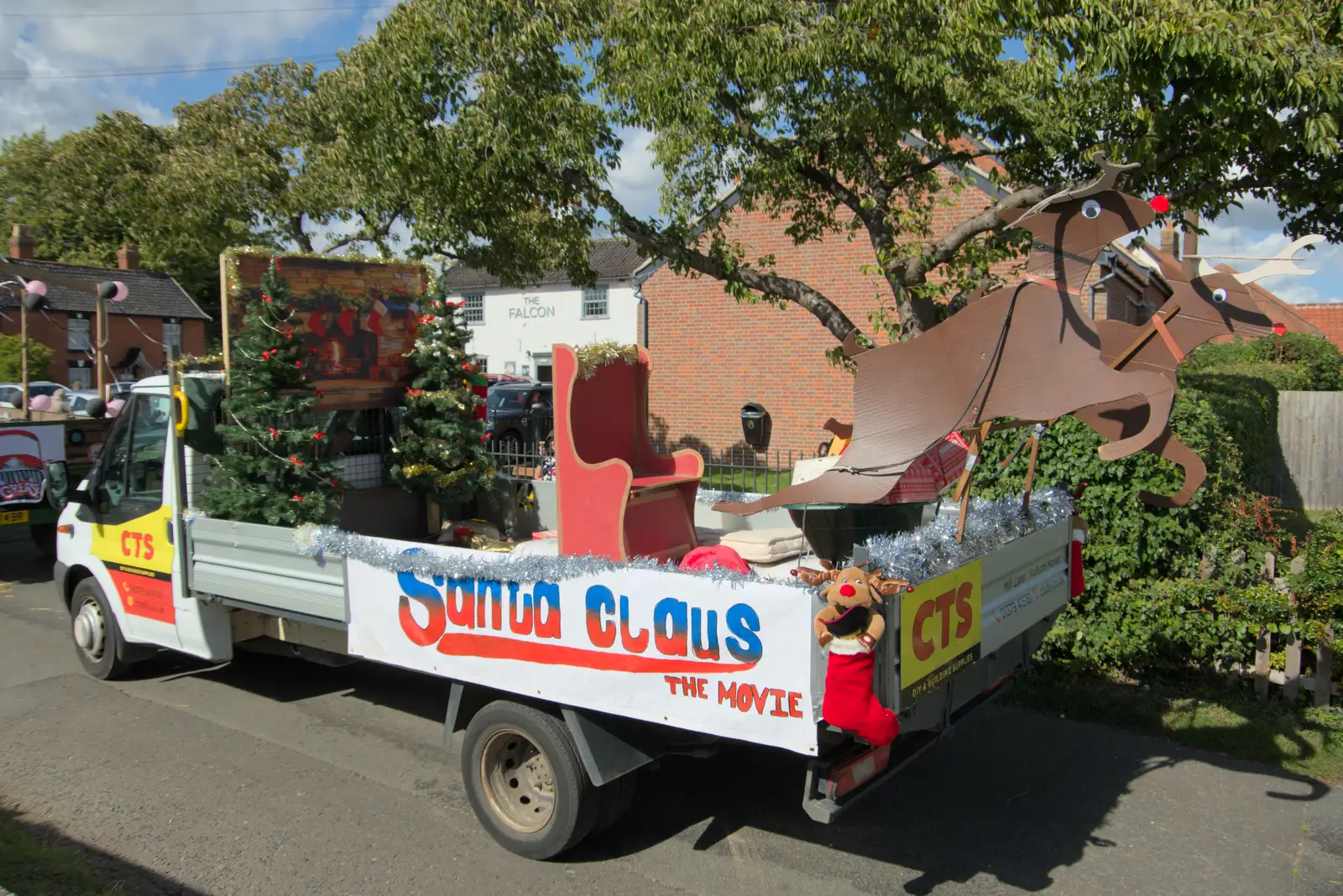 A Christmas-themed float is a bit out of season, from Thorpe Abbots with Mick the Brick, and the GSB at Pulham - 13th September 2025