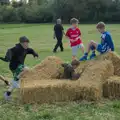 Boys work on destroying the straw bales, The GSB at the Scouts' Duck Race, The Pennings, Eye - 27th September 2025