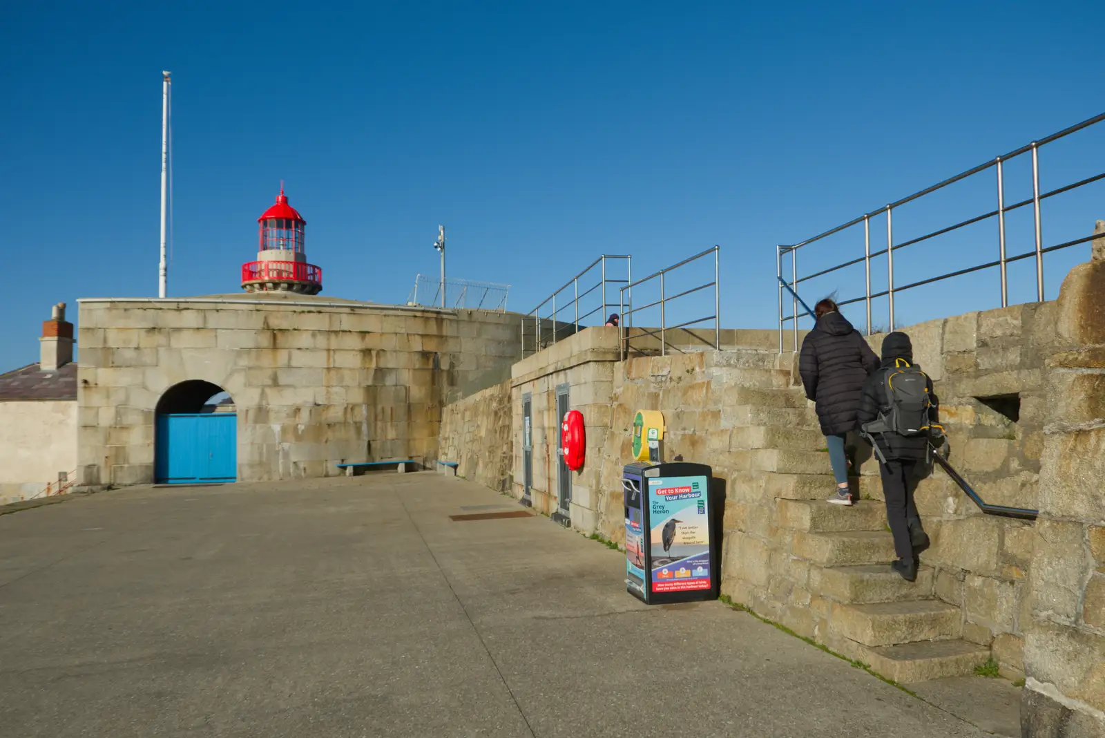 Isobel and Harry near the pier lighthouse, from End of the Line 1: Dún Laoghaire to Howth, Ireland - 29th October 2025