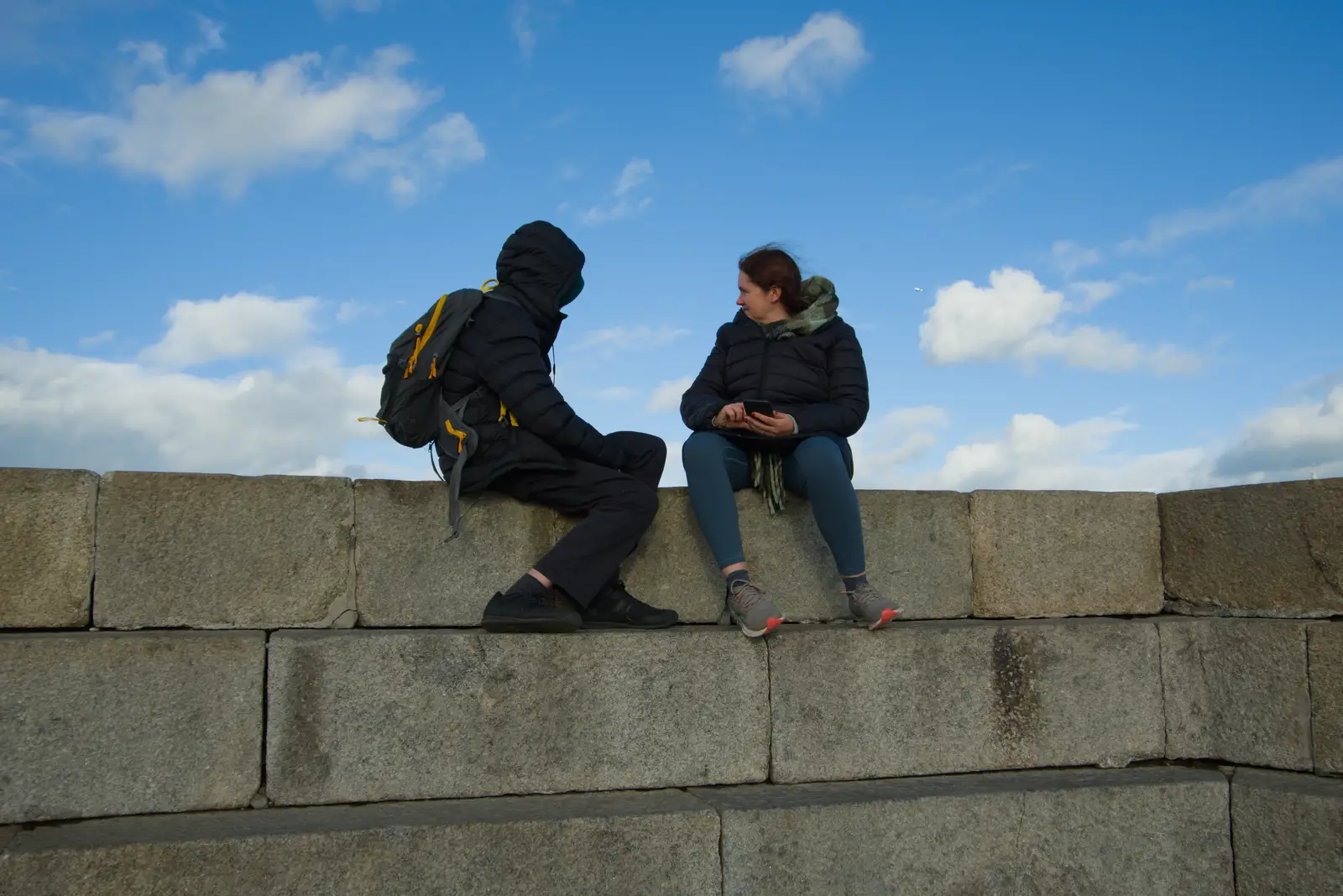 Harry and Isobel sit on the sea wall, from End of the Line 1: Dún Laoghaire to Howth, Ireland - 29th October 2025