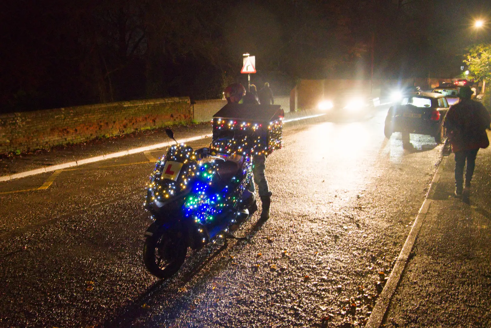 A delivery dude has a Christmas lights moped, from Roadworks and the Christmas Lights Switch-on, Eye, Suffolk - 5th December 2025