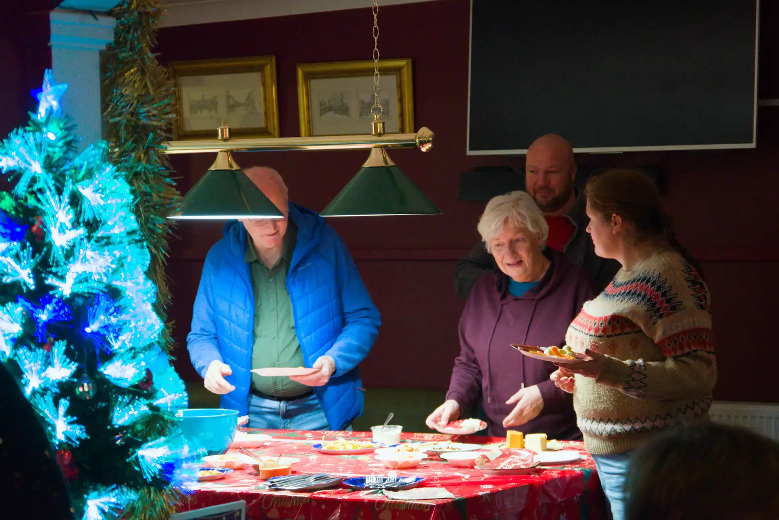 Isobel loads up on carrot sticks, from A Christmas Quiz and a Tractor Run, Brome, Suffolk - 20th December 2025