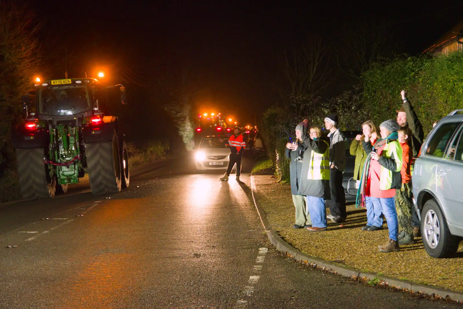 The group waves to the passing tractors, from A Christmas Quiz and a Tractor Run, Brome, Suffolk - 20th December 2025