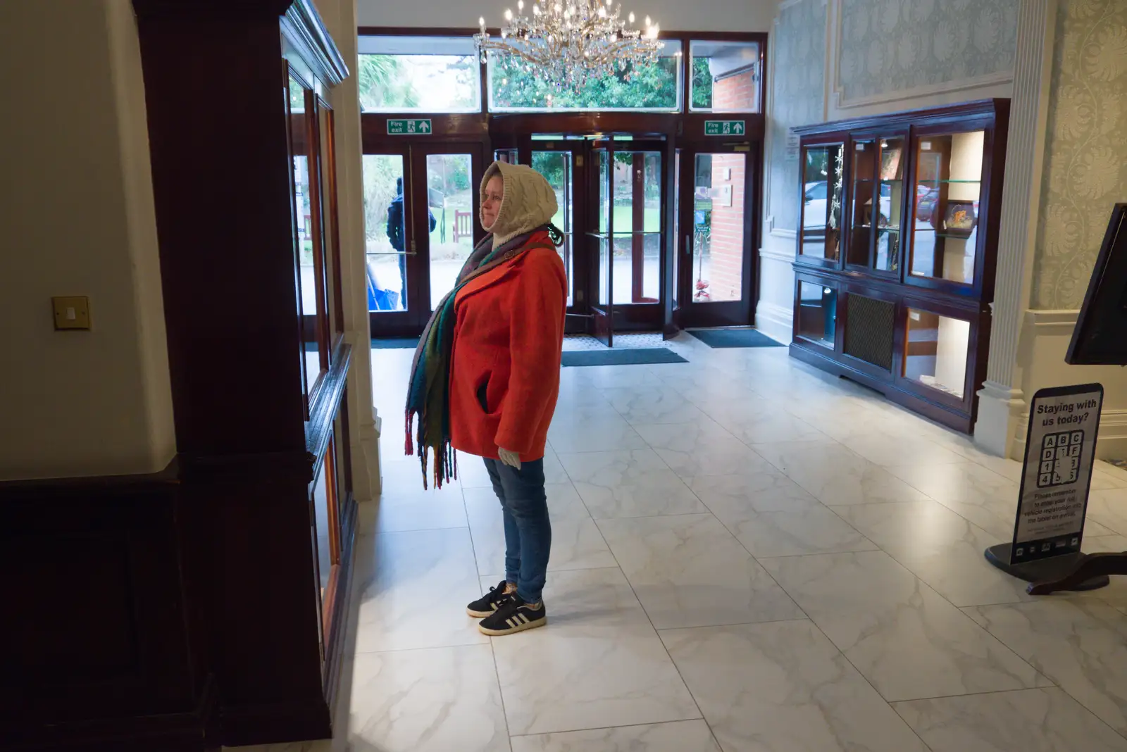 Isobel looks at things in a display cabinet, from A Night at the Orwell Hotel, Felixstowe, Suffolk - 28th December 2025