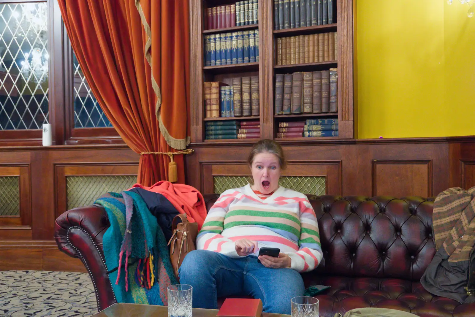 Isobel is surprised by something on her phone, from A Night at the Orwell Hotel, Felixstowe, Suffolk - 28th December 2025