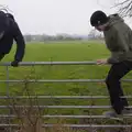The boys take the easy route over a gate, Another Walk to the Crossways, Scole, Norfolk - 25th January 2026
