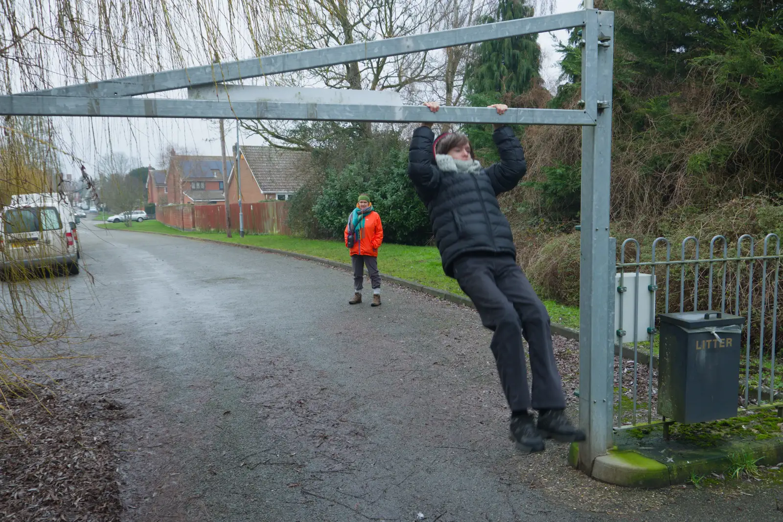 Harry dangles from the pocket park barrier, from Another Walk to the Crossways, Scole, Norfolk - 25th January 2026