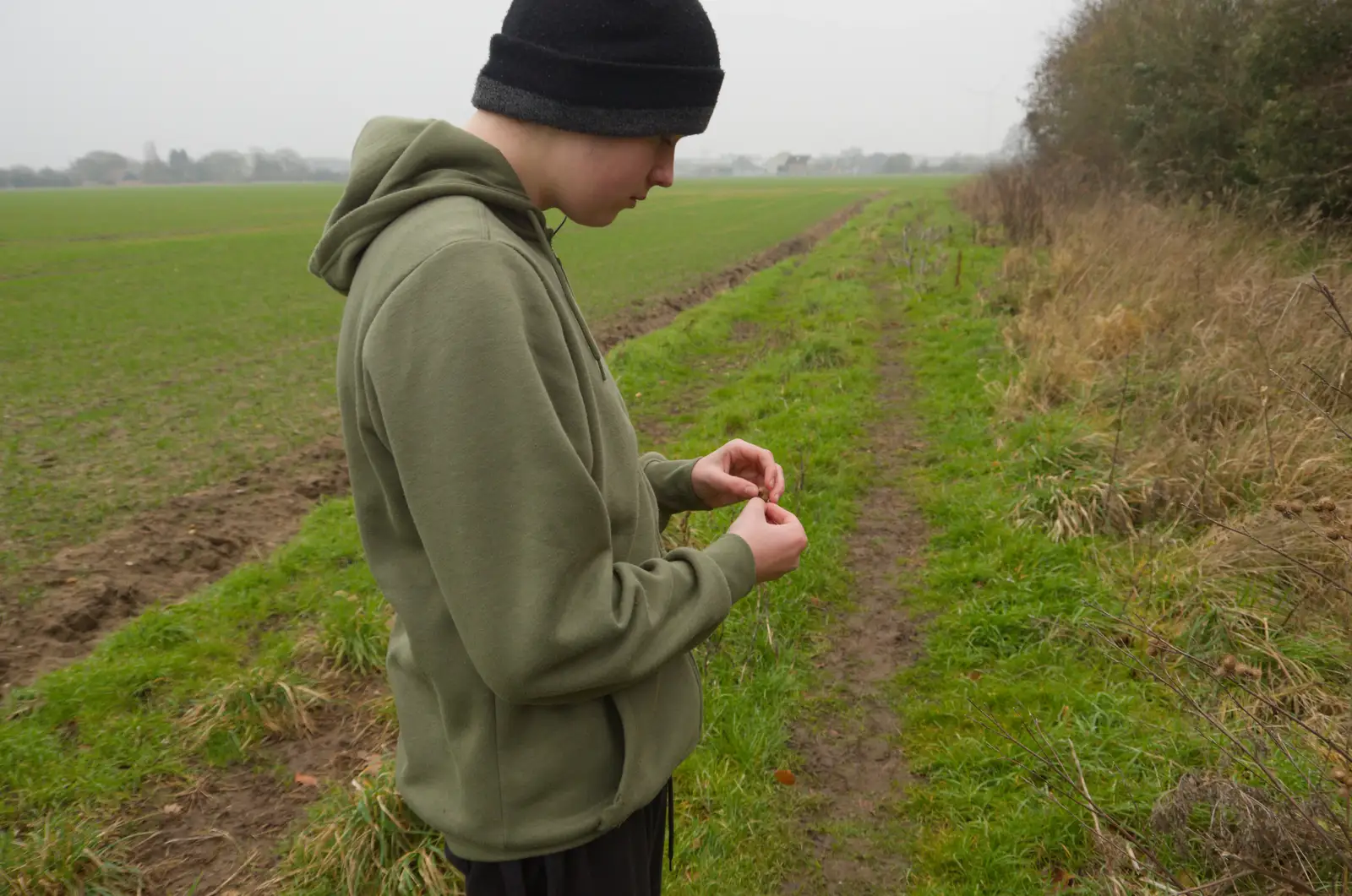 Fred fiddles with something, from Another Walk to the Crossways, Scole, Norfolk - 25th January 2026