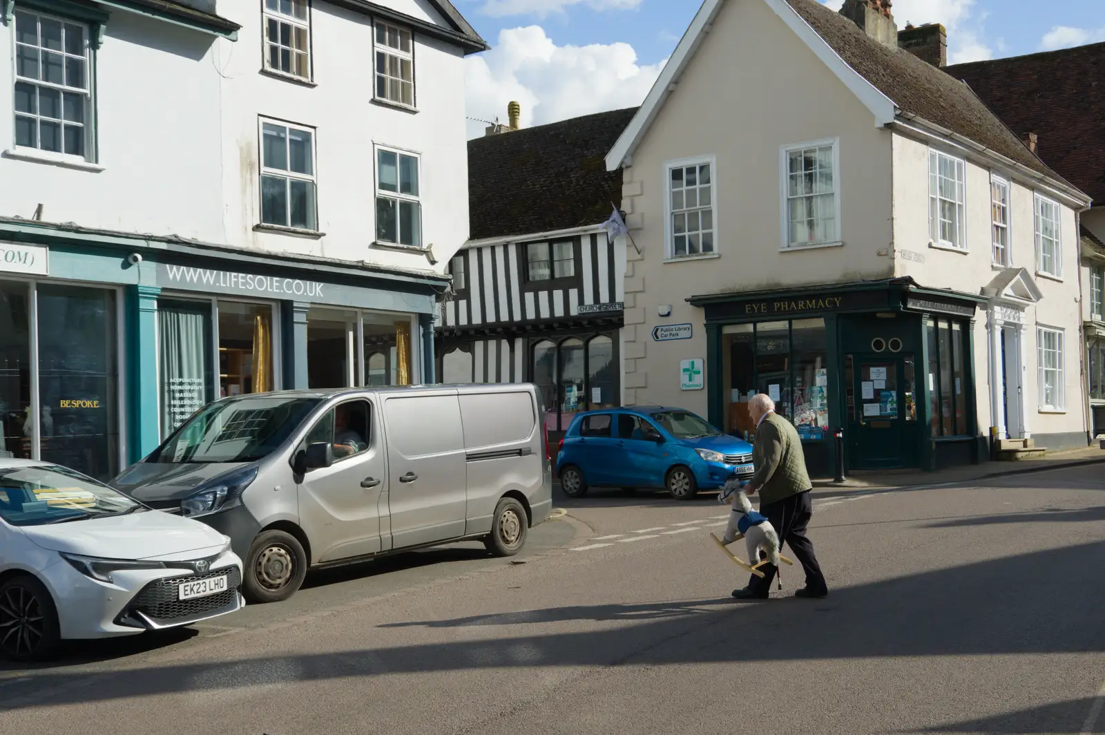 Some dude hauls his booty to a van, from A Small March Miscellany, Eye, Suffolk - 18th MArch 2026