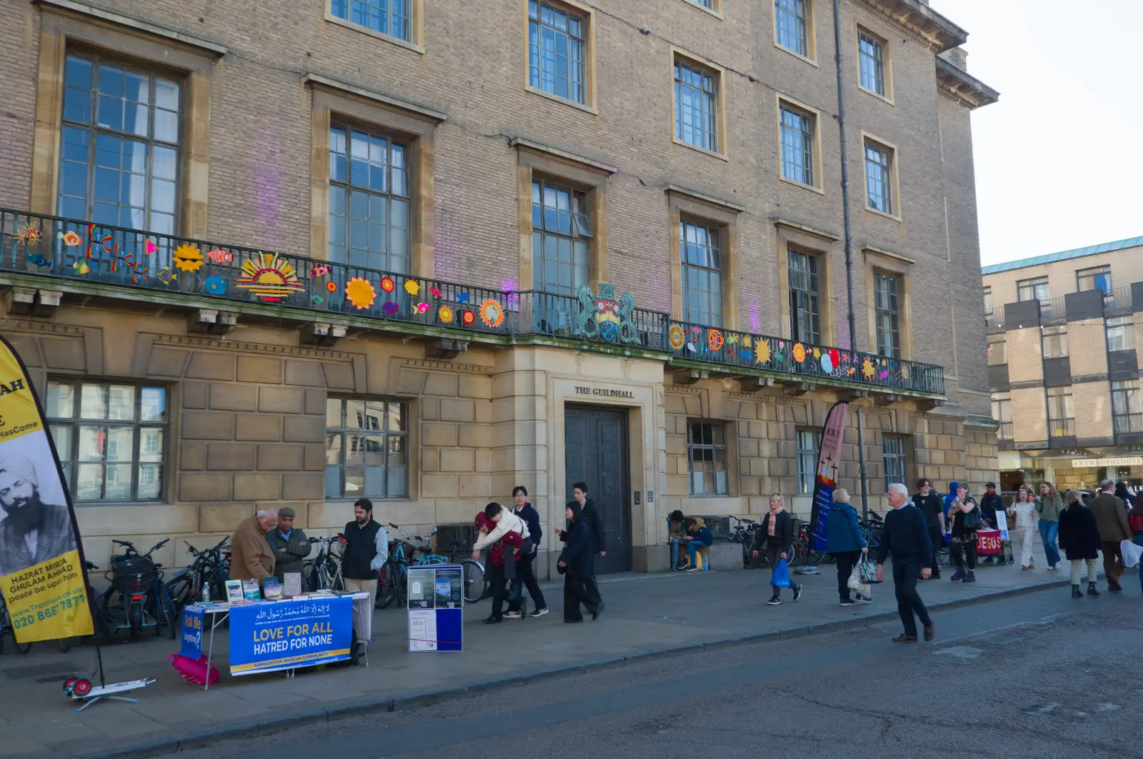 There are varoious suns stuck onto the Guildhall, from Saxophone Shopping in Cambridge - 21st March 2026