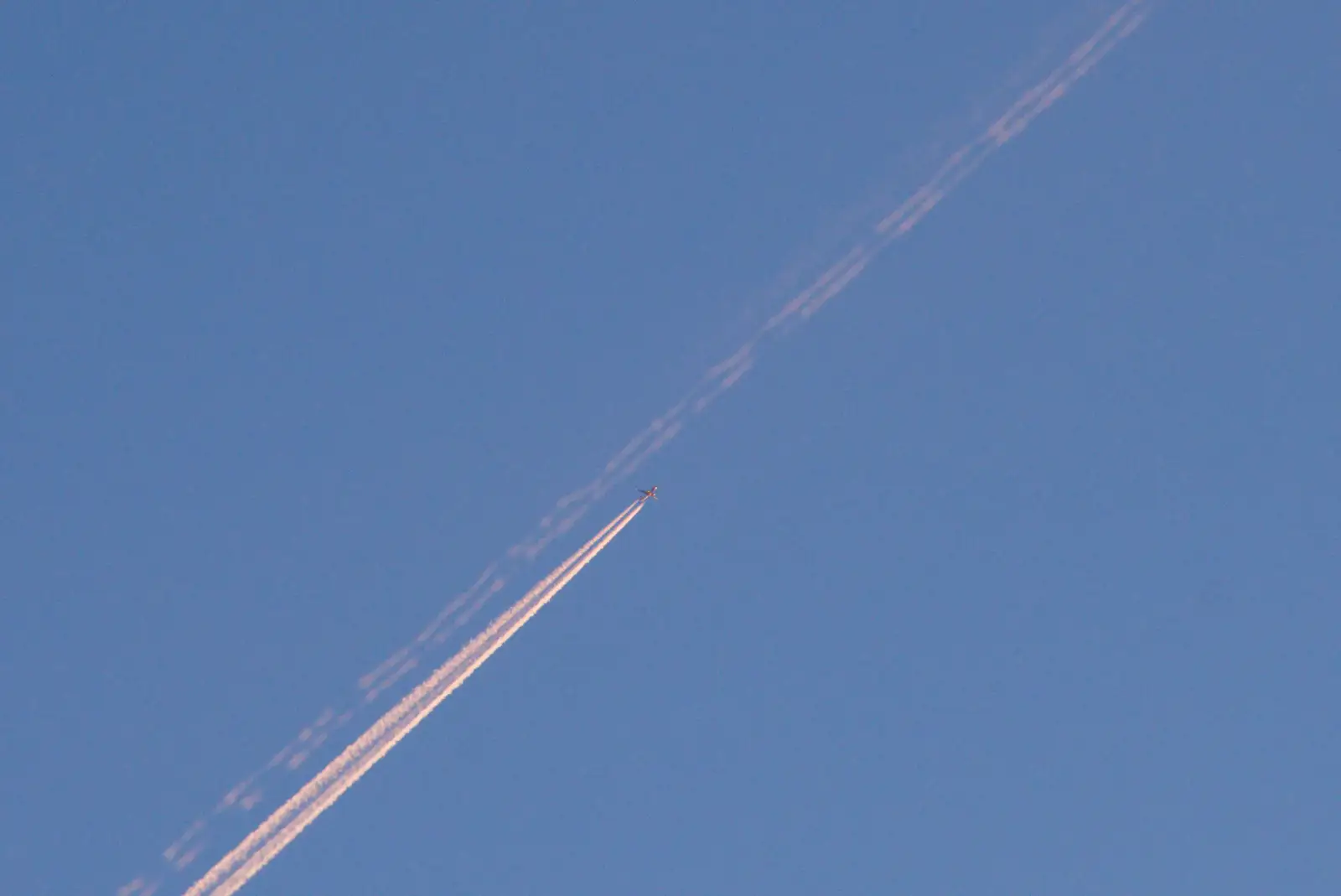 One plane follows the trail of another, from Saxophone Shopping in Cambridge - 21st March 2026