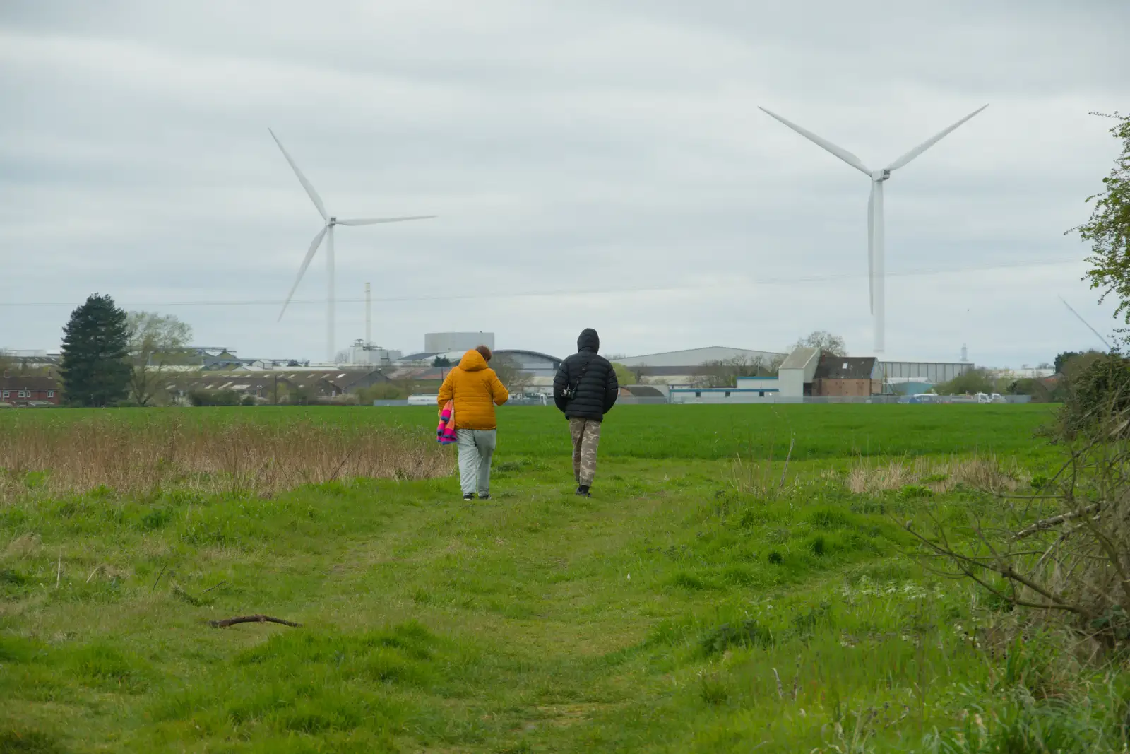 Isobel and Harry wander off across the field, from Walking Around, and Fred's Log, Brome, Suffolk - 3rd April 2026