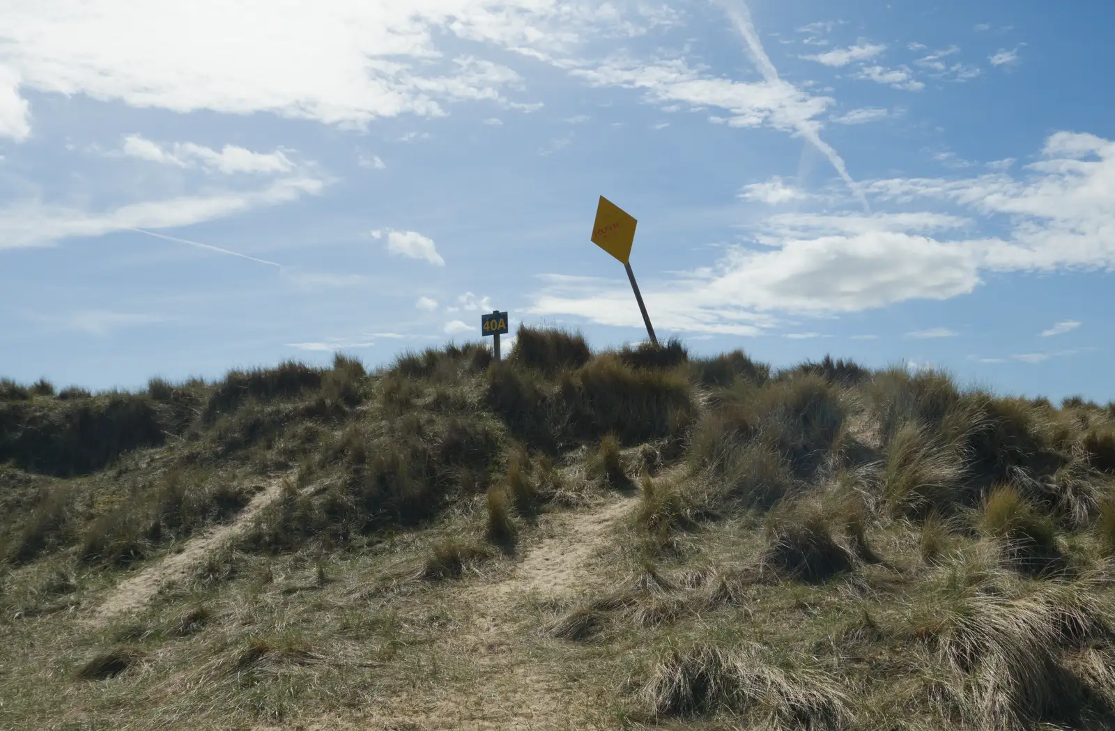 A telegraph cable warning sign keels over, from A Visit to Winterton-on-Sea, Norfolk - 6th April 2026