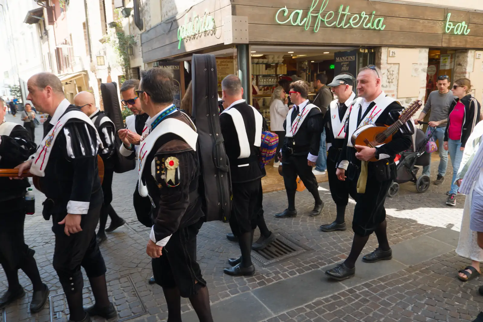 Musicians in traditional dress wander around, from Hauling Boats to Croatia: Toulon to Desenzano, Lake Garda, Italy - 11th April 2026