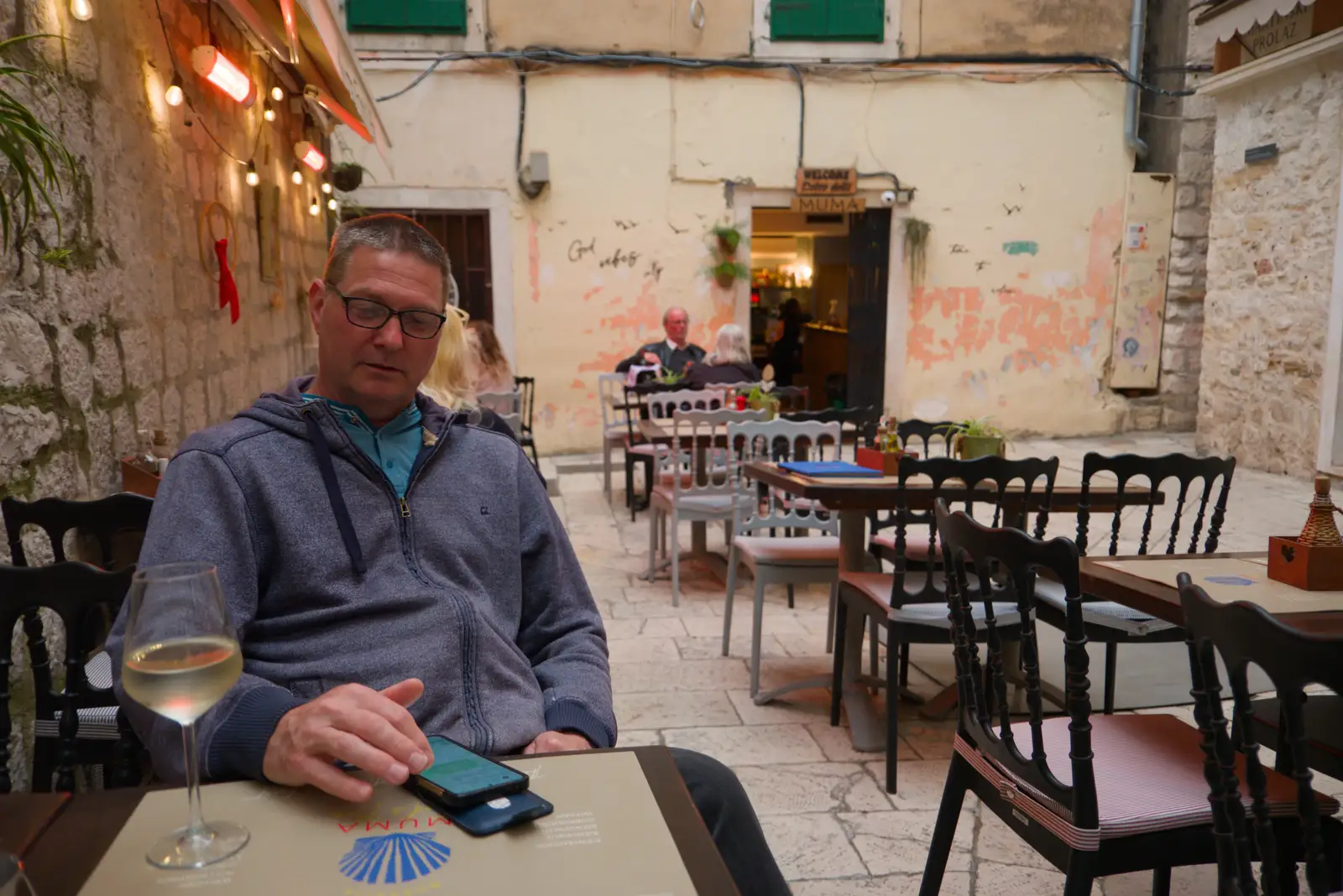 Sean checks for phone updates, from Hauling Boats to Croatia: Desenzano to Split, Croatia - 13th April 2026