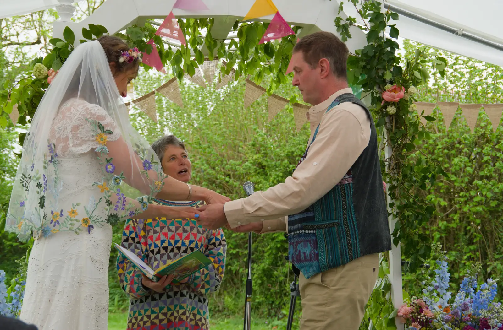 Rings are applied, from Hannah and Sean's Wedding, King's Nympton, Devon - 3rd May 2026