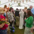 Sean and Hannah squeeze through the crowds, Hannah and Sean's Wedding, King's Nympton, Devon - 3rd May 2026