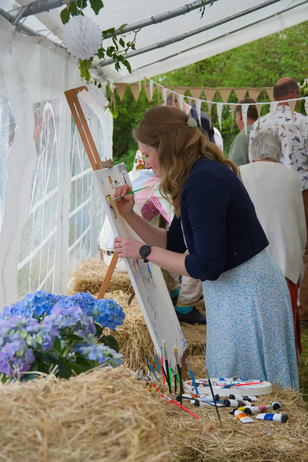 Someone contributes to the community painting, from Hannah and Sean's Wedding, King's Nympton, Devon - 3rd May 2026