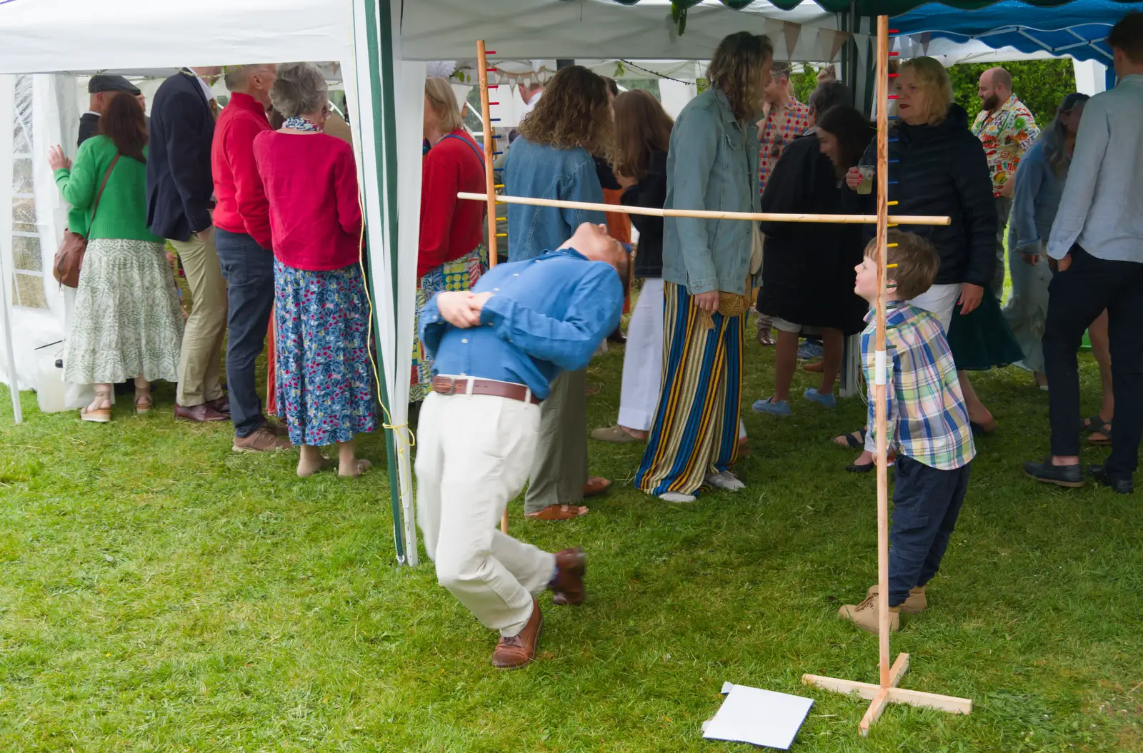 Outside, a bit of limbo is happening, from Hannah and Sean's Wedding, King's Nympton, Devon - 3rd May 2026