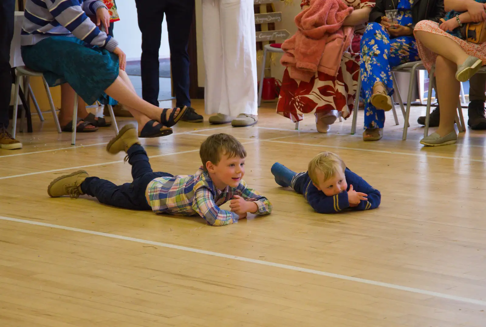 Two small boys watch the action from the floor, from Hannah and Sean's Wedding, King's Nympton, Devon - 3rd May 2026