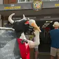 An ice-cream-licking cow on New Street, A Bus Trip to Wells Next the Sea, Norfolk - 28th May 2026
