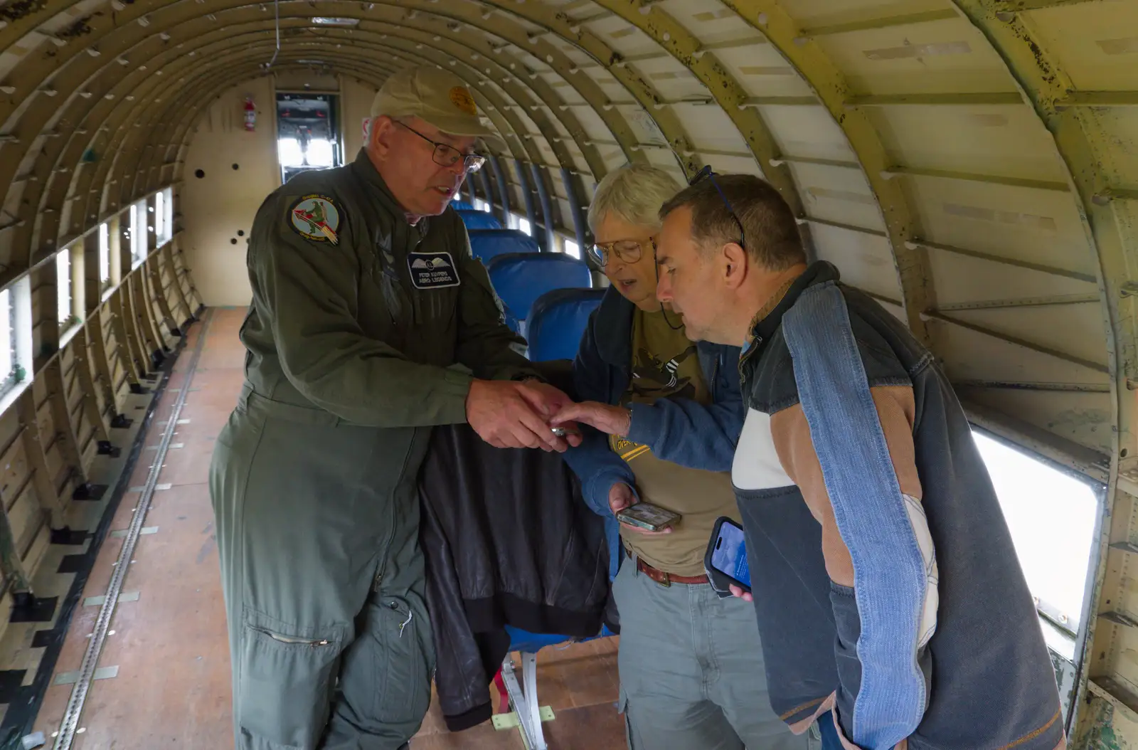 Clive looks at something on a phone, from Flying to Cherbourg on a C-47 Dakota, Normandy, France - 1st June 2026