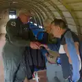 Clive looks at something on a phone, Flying to Cherbourg on a C-47 Dakota, Normandy, France - 1st June 2026