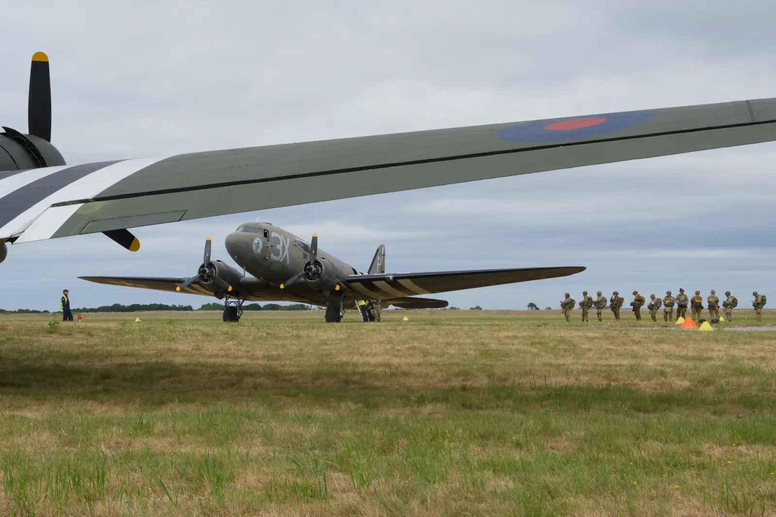 A line of paratroopers waits to board, from Flying to Cherbourg on a C-47 Dakota, Normandy, France - 1st June 2026