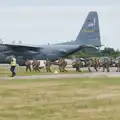 A new line of paratroopers walks past the C-130, Flying to Cherbourg on a C-47 Dakota, Normandy, France - 1st June 2026