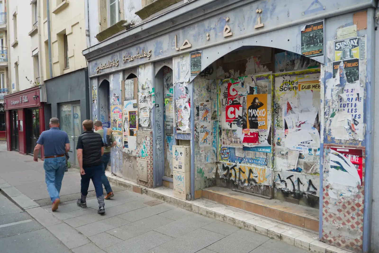 A heavily-postered closed-down restaurant, from Flying to Cherbourg on a C-47 Dakota, Normandy, France - 1st June 2026