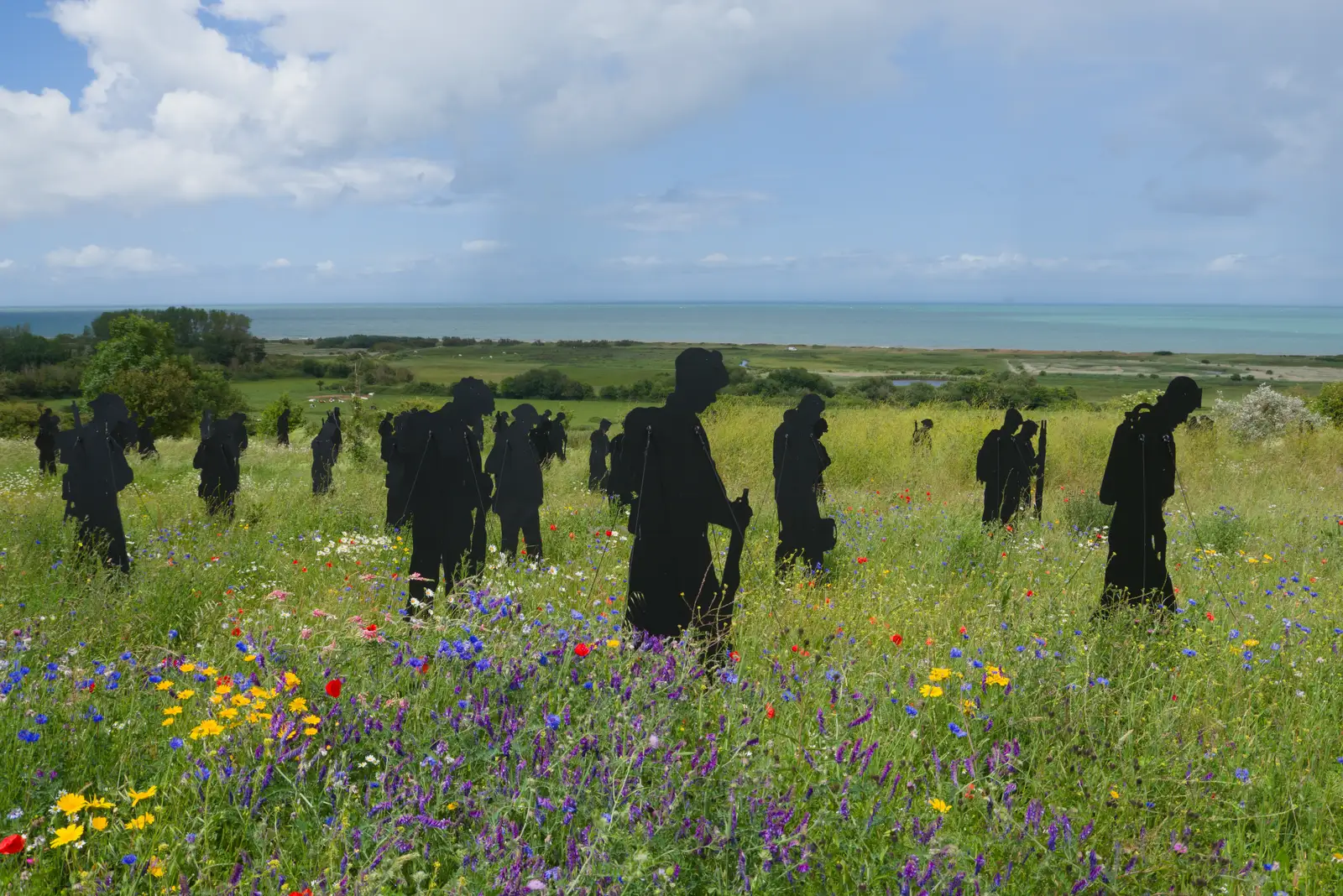 Silhouettes in a field of wild flowers, from Pegasus Bridge, the British Memorial and Arromaches, Normandy - 2nd June 2026