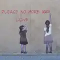 Banksy-esque graffiti on a wall, Pegasus Bridge, the British Memorial and Arromaches, Normandy - 2nd June 2026