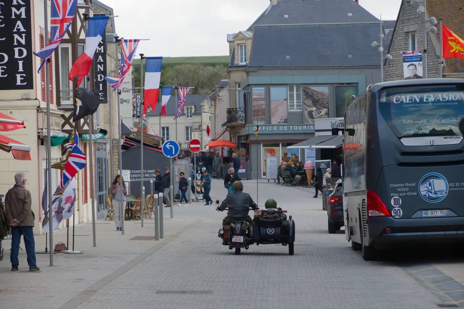 A motorbike and sidecar rides into town, from Pegasus Bridge, the British Memorial and Arromaches, Normandy - 2nd June 2026