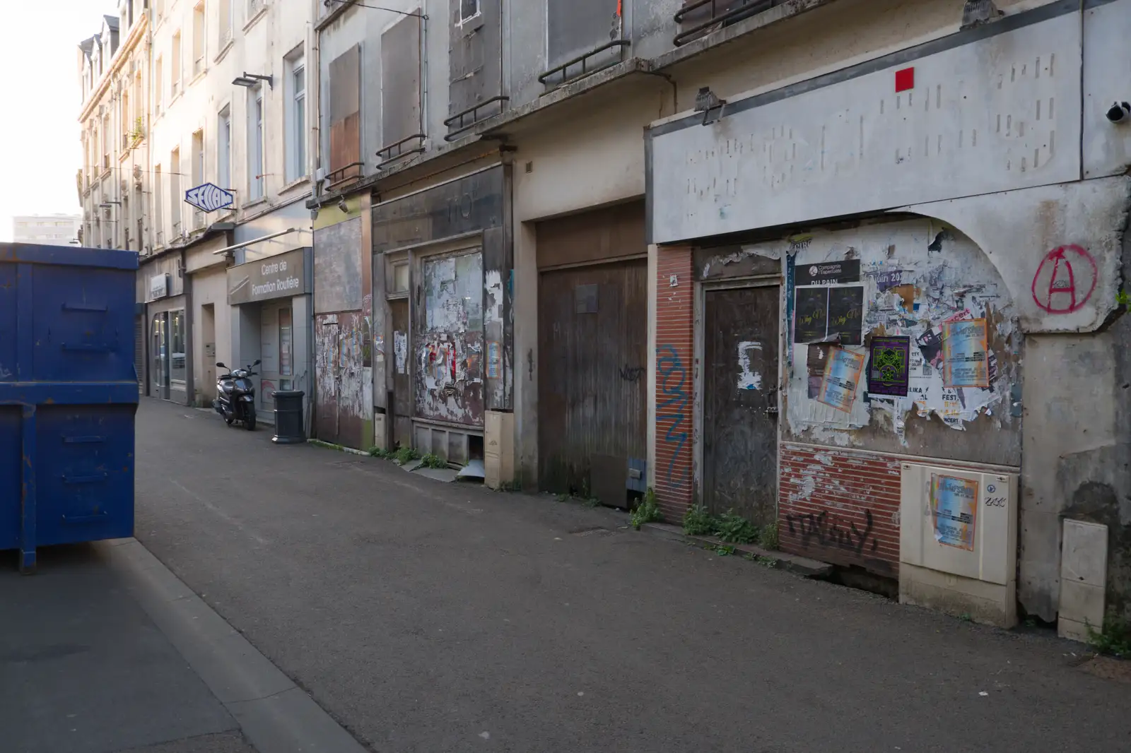 Bill-poster dereliction on Rue Henri Dunant, from Pegasus Bridge, the British Memorial and Arromaches, Normandy - 2nd June 2026