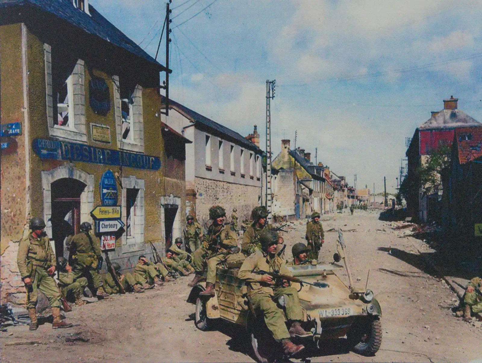 A colourised photo of wartime St. Mère Église, from Sainte-Mère-Élgise and Saint-Côme-du-Mont, Normandy, France - 3rd June 2026