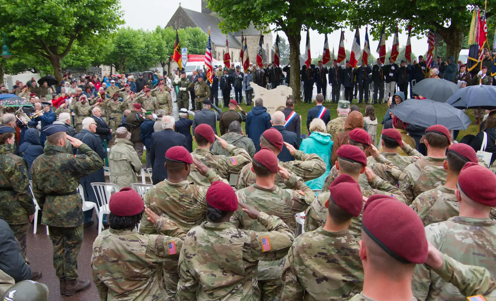 Active US servicepeople take a salute, from Sainte-Mère-Élgise and Saint-Côme-du-Mont, Normandy, France - 3rd June 2026