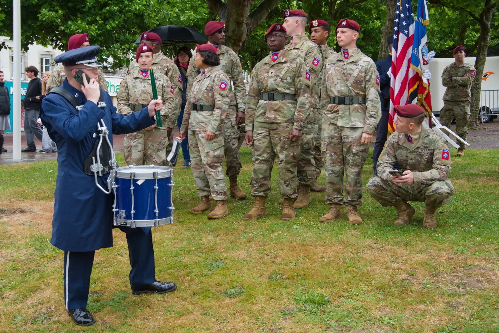 A side-drummer is on the phone, from Sainte-Mère-Élgise and Saint-Côme-du-Mont, Normandy, France - 3rd June 2026