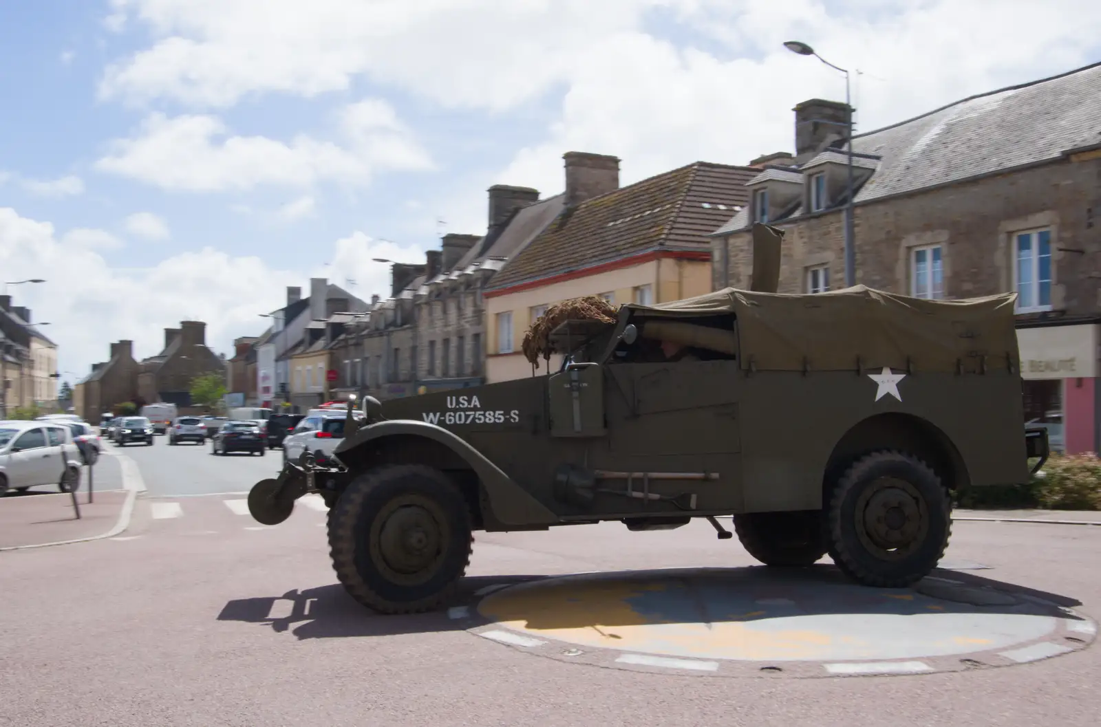 A military vehicle drives right over the roundabout, from Quettehou, Sainte-Marie-du-Mont and the D-Day Museum, Utah Beach - 4th June 2026