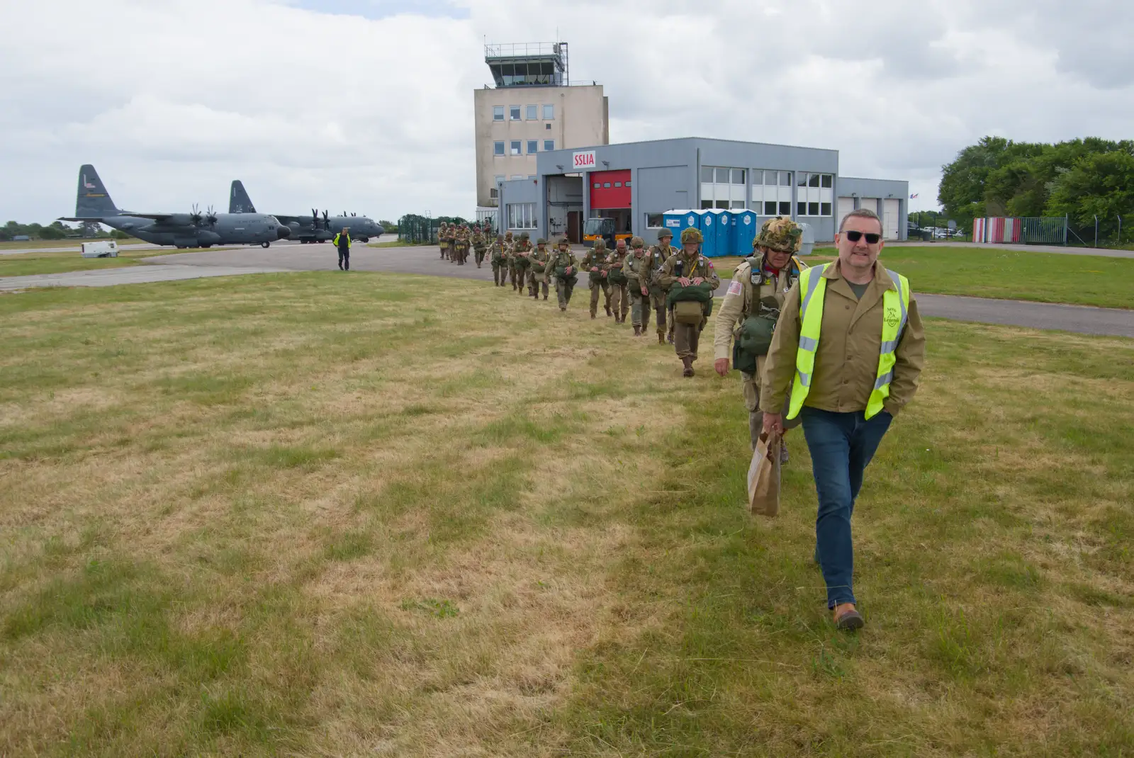 Clive leads the other group onto the airfield, from A D-Day Veteran's Dakota Flight, Cherbourg, Normandy - 5th June 2026