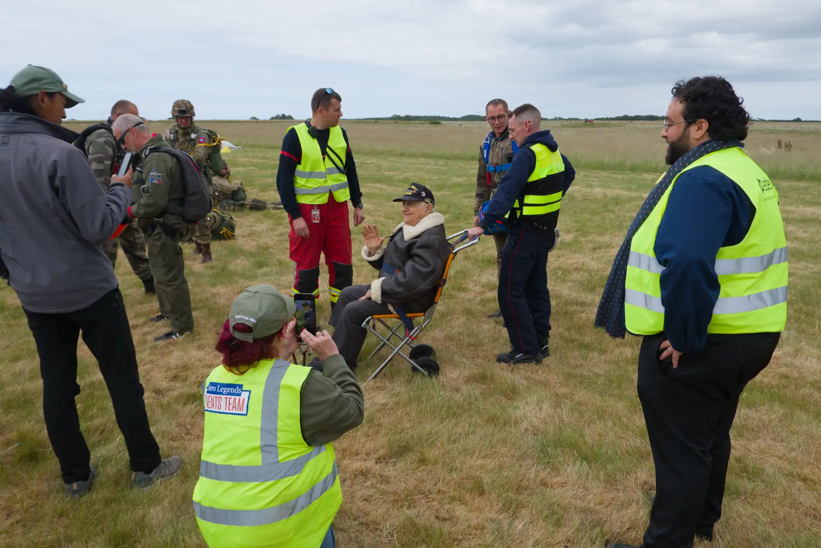 The D-Day veteran is in a wheeled chair, from A D-Day Veteran's Dakota Flight, Cherbourg, Normandy - 5th June 2026