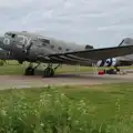 Drag 'em Oot is parked up by the hangar, Cité de lar Mer and a Dakota Flight Home, Cherbourg - 7th June 2026