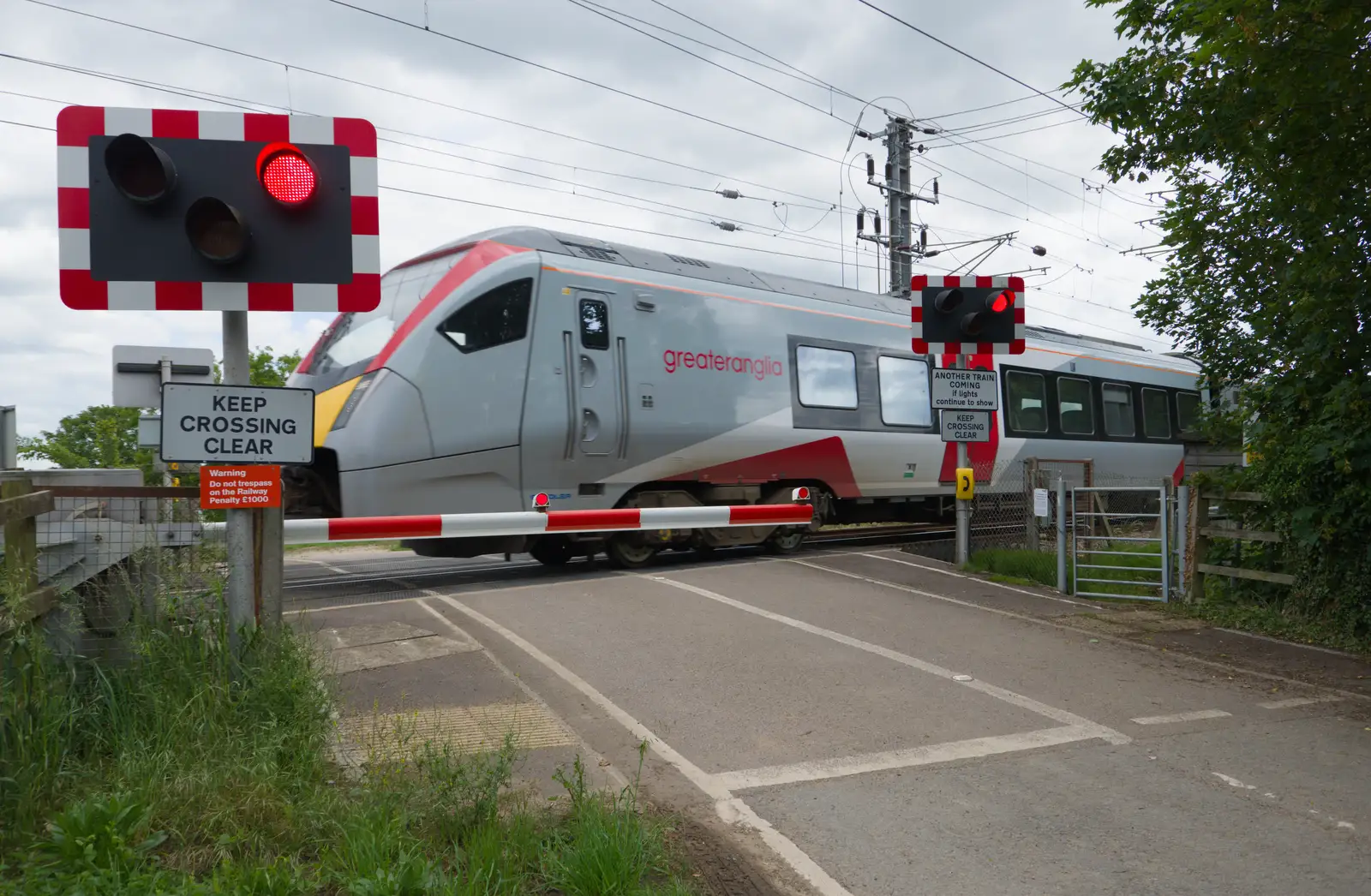 A train rumbles through the Rectory Road crossing, from Mellis Gardens and a Walk to Diss, Norfolk - 13th June 2026