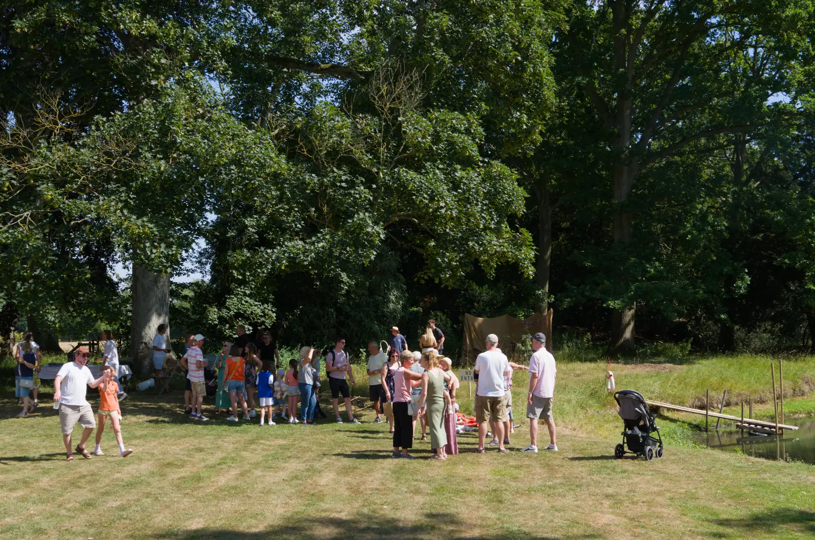 The fete crowds huddle under the trees, from The GSB at Barningham, West Suffolk - 11th July 2026