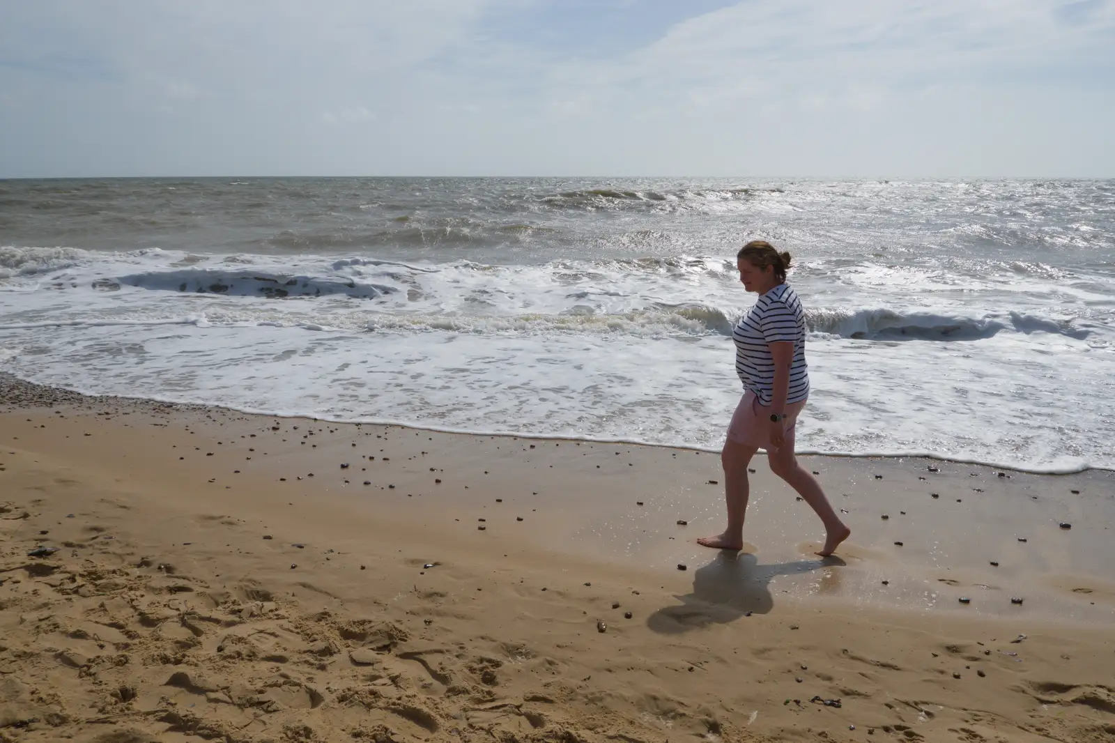 Isobel stumps up the beach, from Harry's Karate Kamp, Harbour Campsite, Southwold - 12th July 2026
